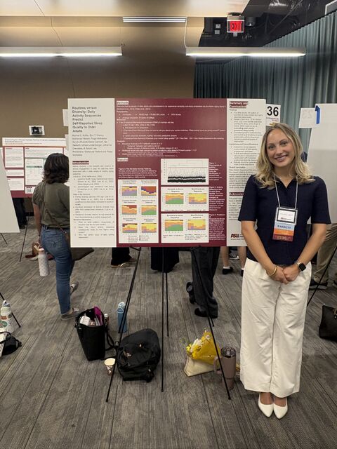 McKenzie beside the research poster at the ASU symposium